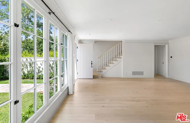 a view of an empty room with windows