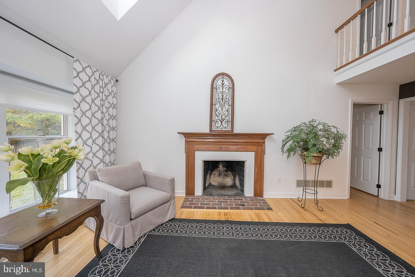 403 Chester Road Devon, PA 19333 - Photo 12 of 35 Family room - fireplace with brick hearth