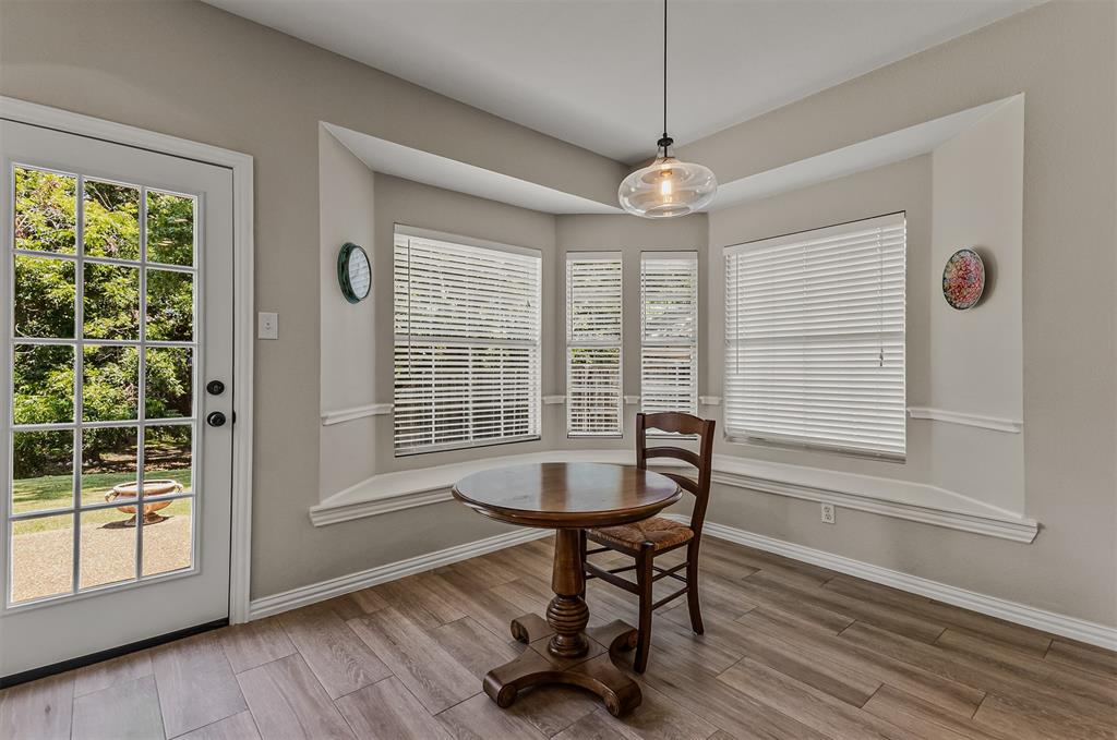 9301 Nottingham Court Rowlett, TX 75088 - Photo 10 of 39 Bay window area with wood-finish flooring and a glass-paned exterior door