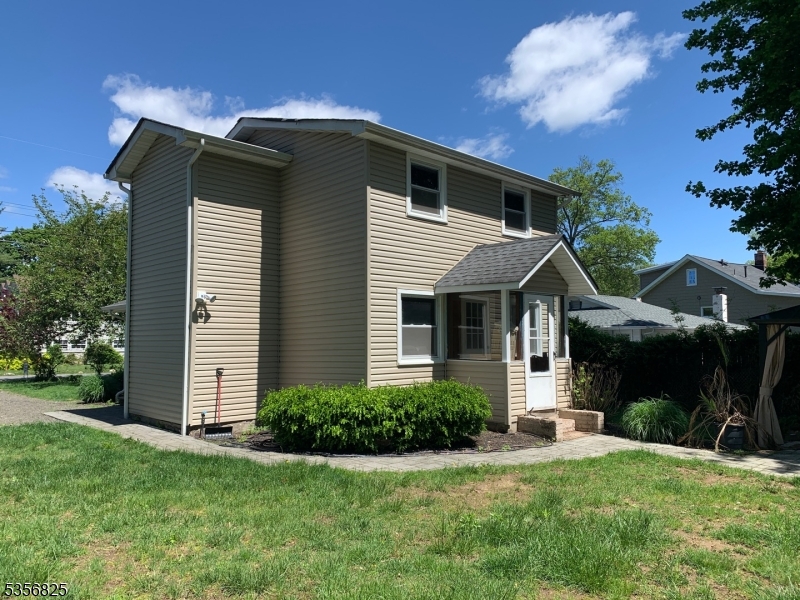 7 Shore Road Wayne, NJ 07470 - Photo 2 of 13 a front view of a house with a yard