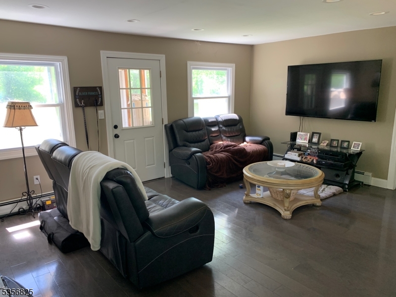 7 Shore Road Wayne, NJ 07470 - Photo 4 of 13 a living room with furniture and a flat screen tv