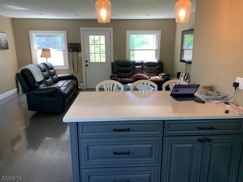 7 Shore Road Wayne, NJ 07470 - Photo 7 of 13 a living room with furniture and a potted plant
