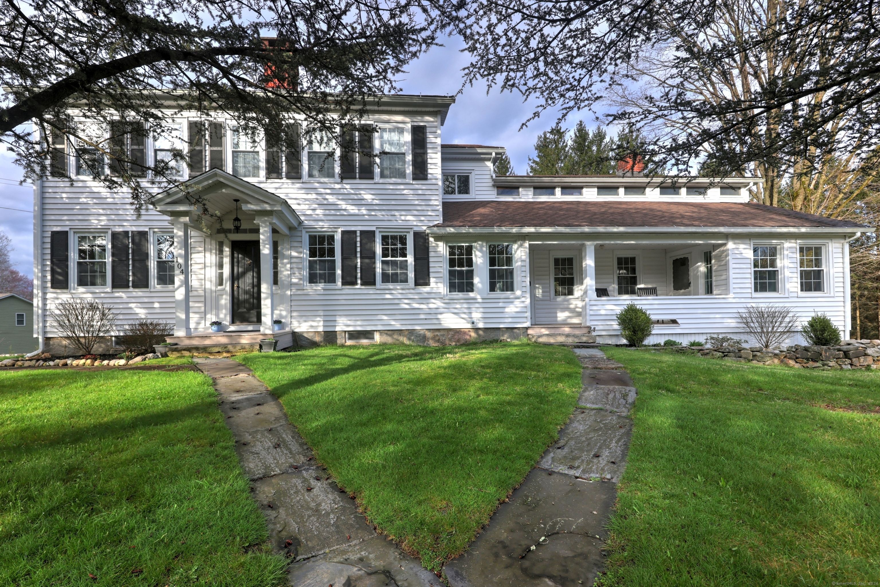 front view of a house with a yard