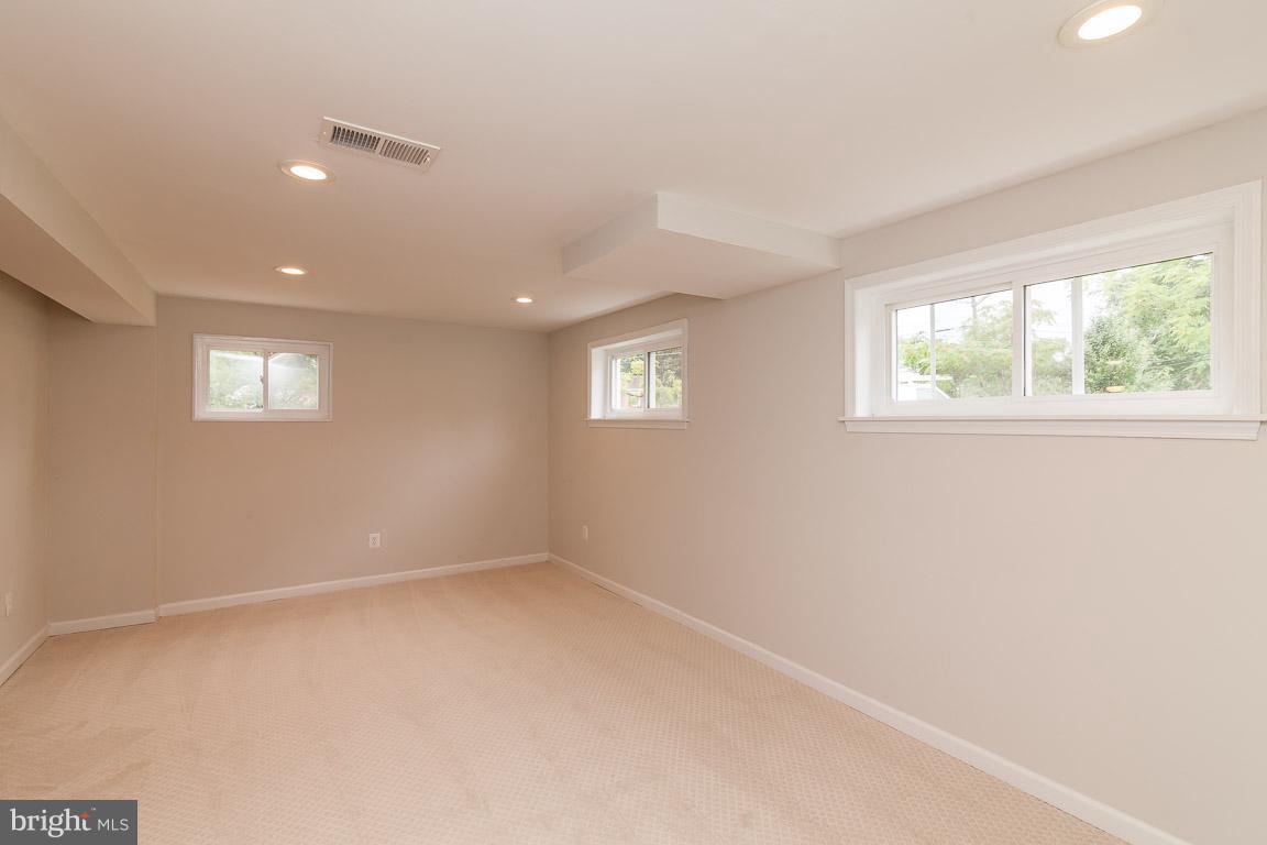 6009 Backlick Road Springfield, VA 22150 - Photo 14 of 21 an empty room with windows