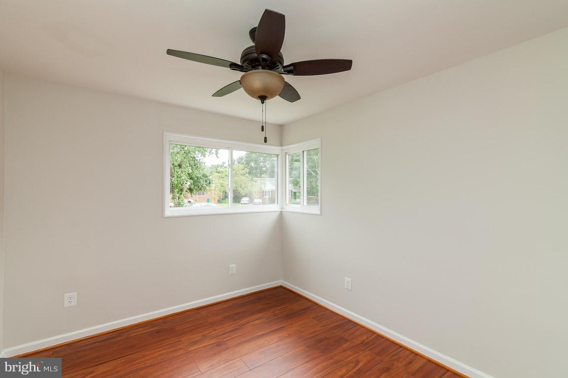 6009 Backlick Road Springfield, VA 22150 - Photo 10 of 21 a view of a room with wooden floor fan and windows