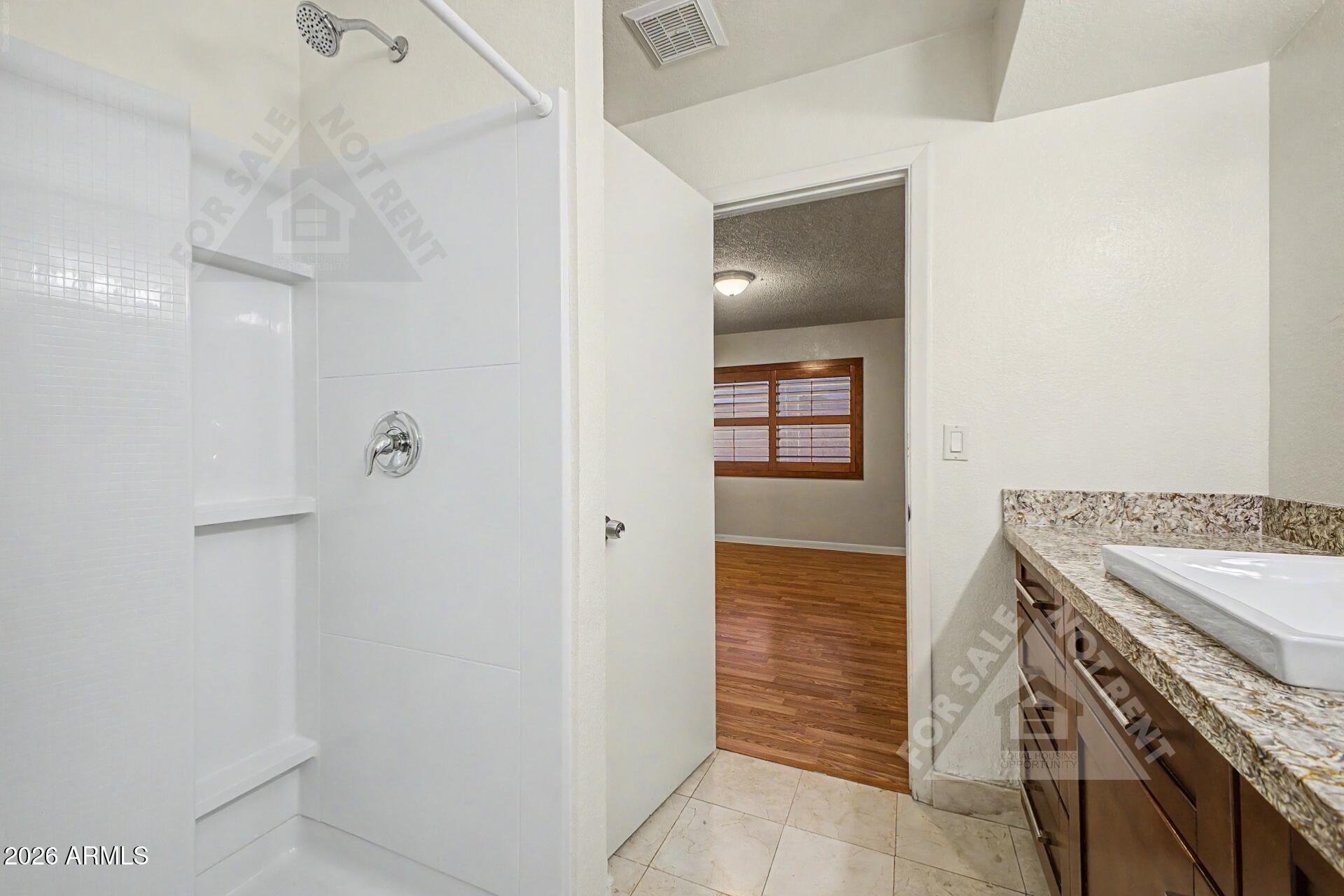 912 East Villa Rita Drive Phoenix, AZ 85022 - Photo 19 of 27 a kitchen with a stove and a refrigerator