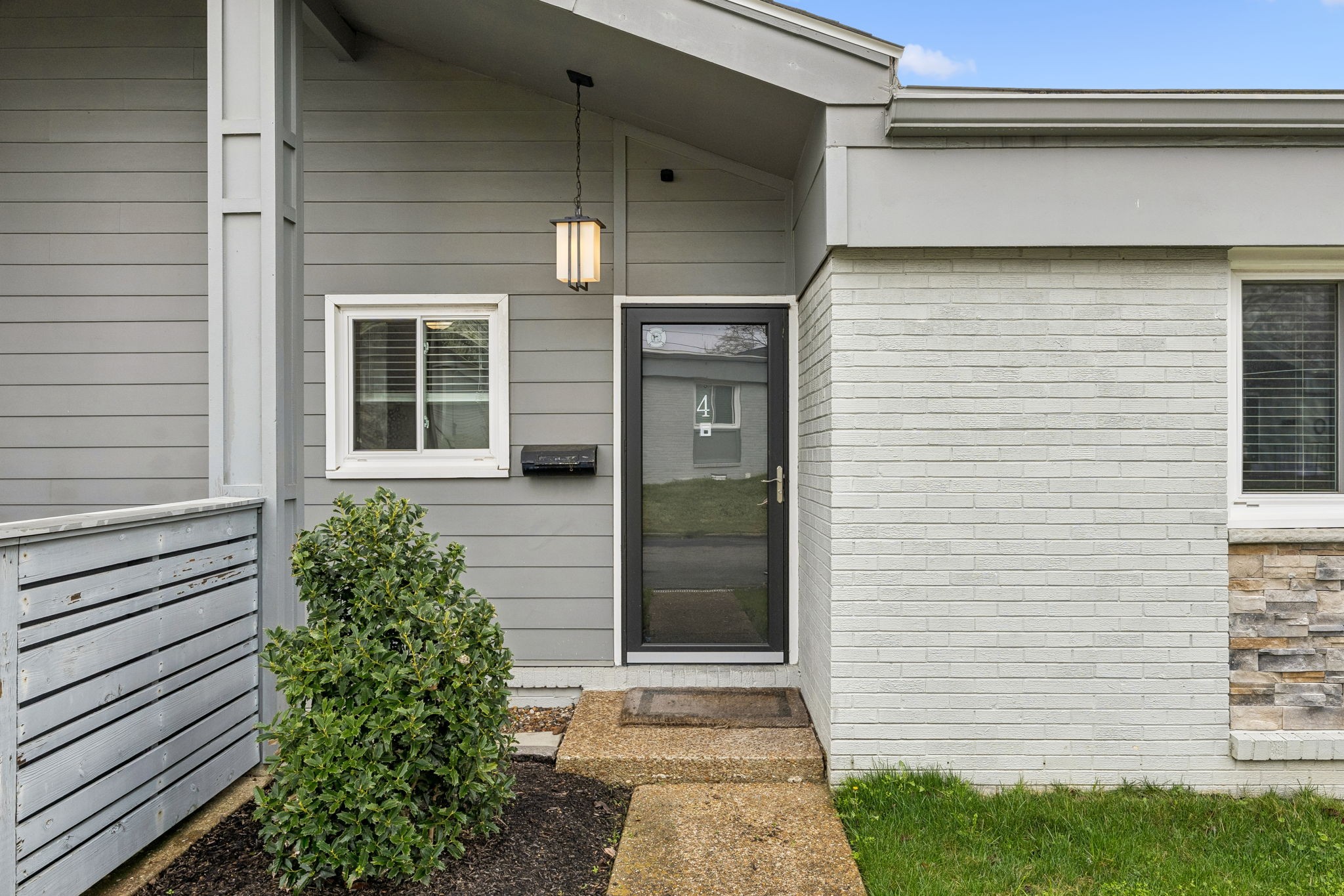 1900 Richard Jones Road, Unit M4 Nashville, TN 37215 - Photo 2 of 16 a front view of a house with a yard