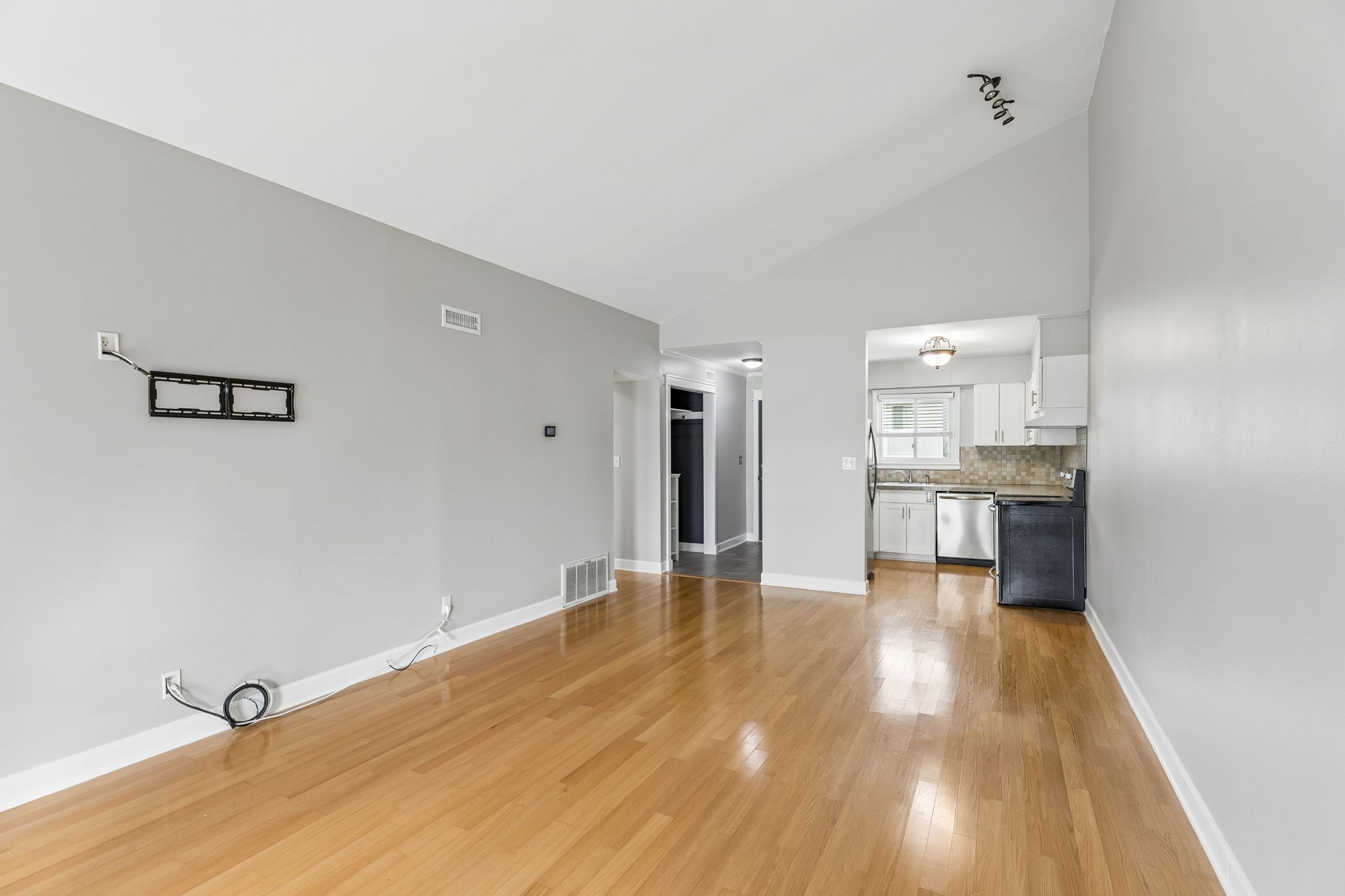 1900 Richard Jones Road, Unit M4 Nashville, TN 37215 - Photo 5 of 16 a view of a kitchen with a sink and a refrigerator