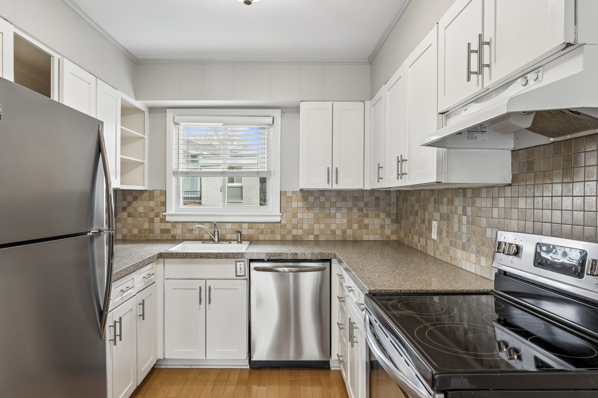 1900 Richard Jones Road, Unit M4 Nashville, TN 37215 - Photo 6 of 16 a kitchen with white cabinets and white appliances