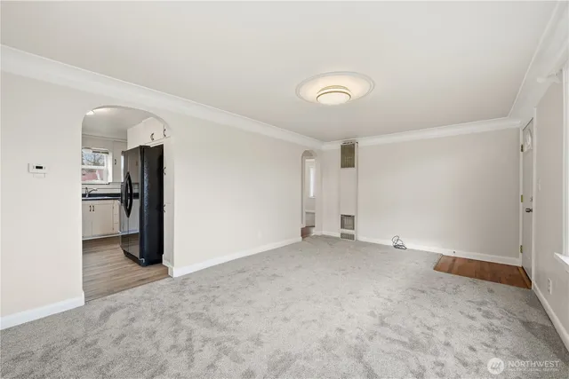 an empty room with closet and wooden floor