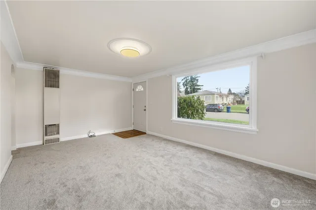 an empty room with windows and closet