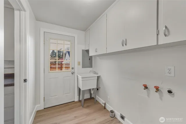 a room with a window and wooden floor