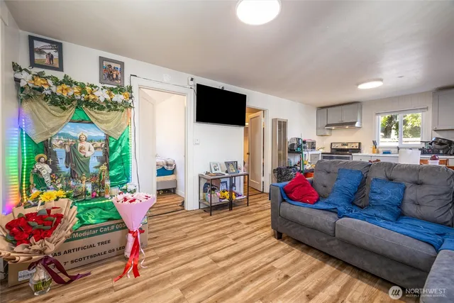 a living room with furniture and a flat screen tv