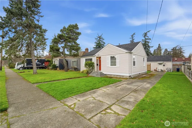 a front view of a house with a yard