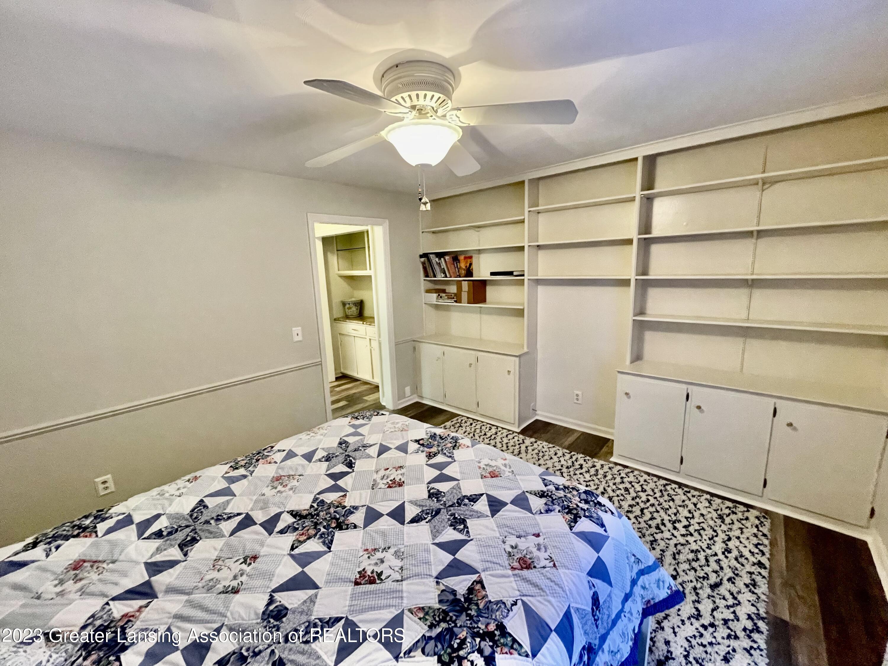 1740 Wellington Road, Unit 112 Lansing, MI 48910 - Photo 20 of 28 Bedroom Two and Built-in Shelves