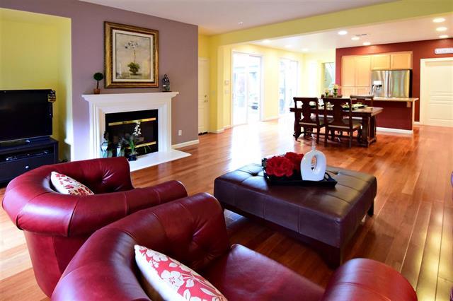1175 Arrowfield Way San Ramon, CA 94582 - Photo 11 of 27 a living room with furniture a dining table and a fireplace