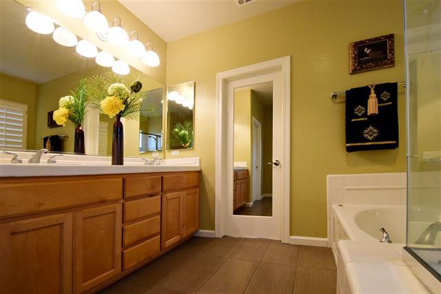 1175 Arrowfield Way San Ramon, CA 94582 - Photo 24 of 27 a bathroom with a double vanity sink and a mirror