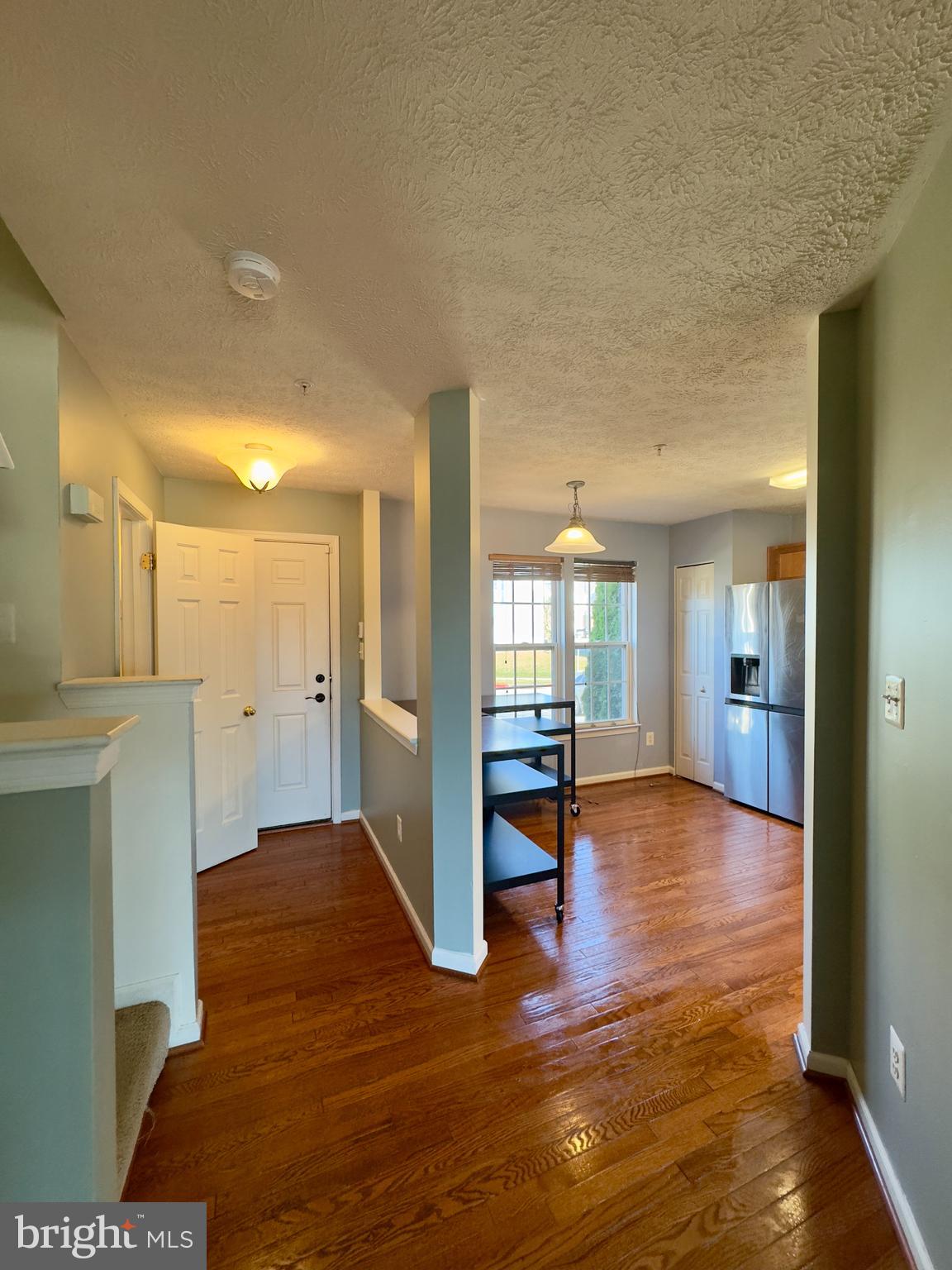 657 Possum Trot Way Aberdeen, MD 21001 - Photo 19 of 25 a view of a hallway with wooden floor and a bathroom