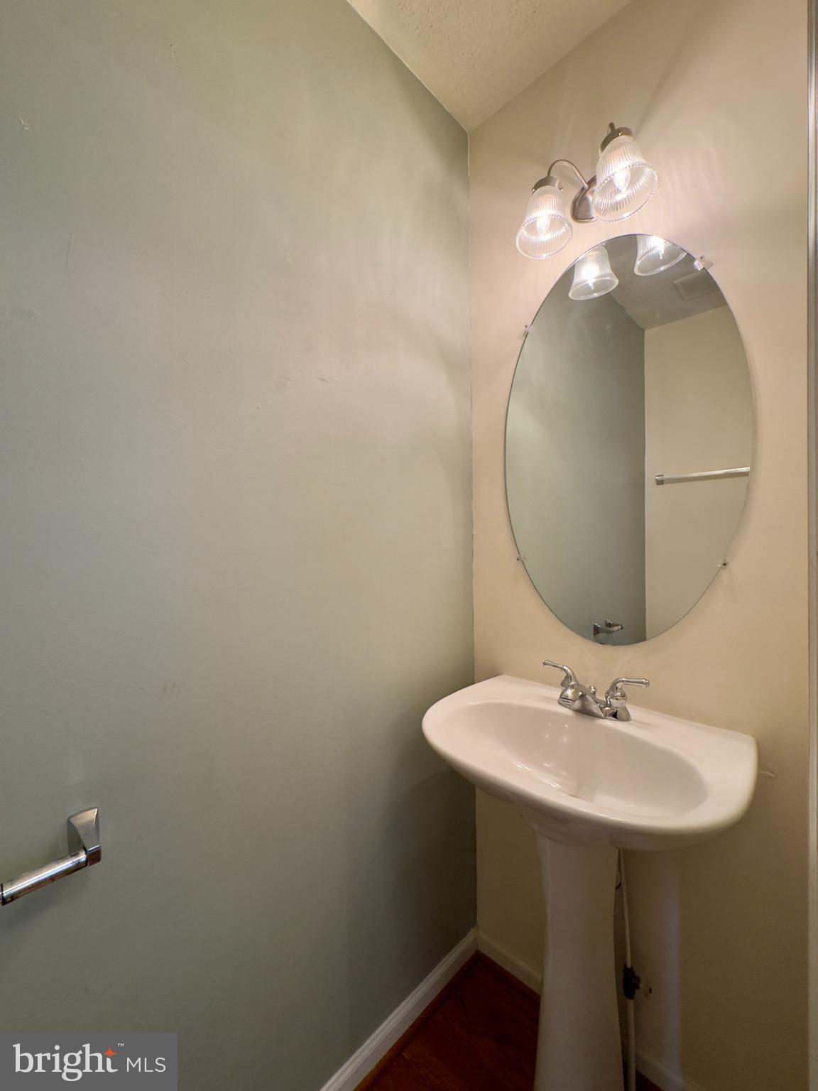 657 Possum Trot Way Aberdeen, MD 21001 - Photo 22 of 25 a bathroom with a sink and a mirror