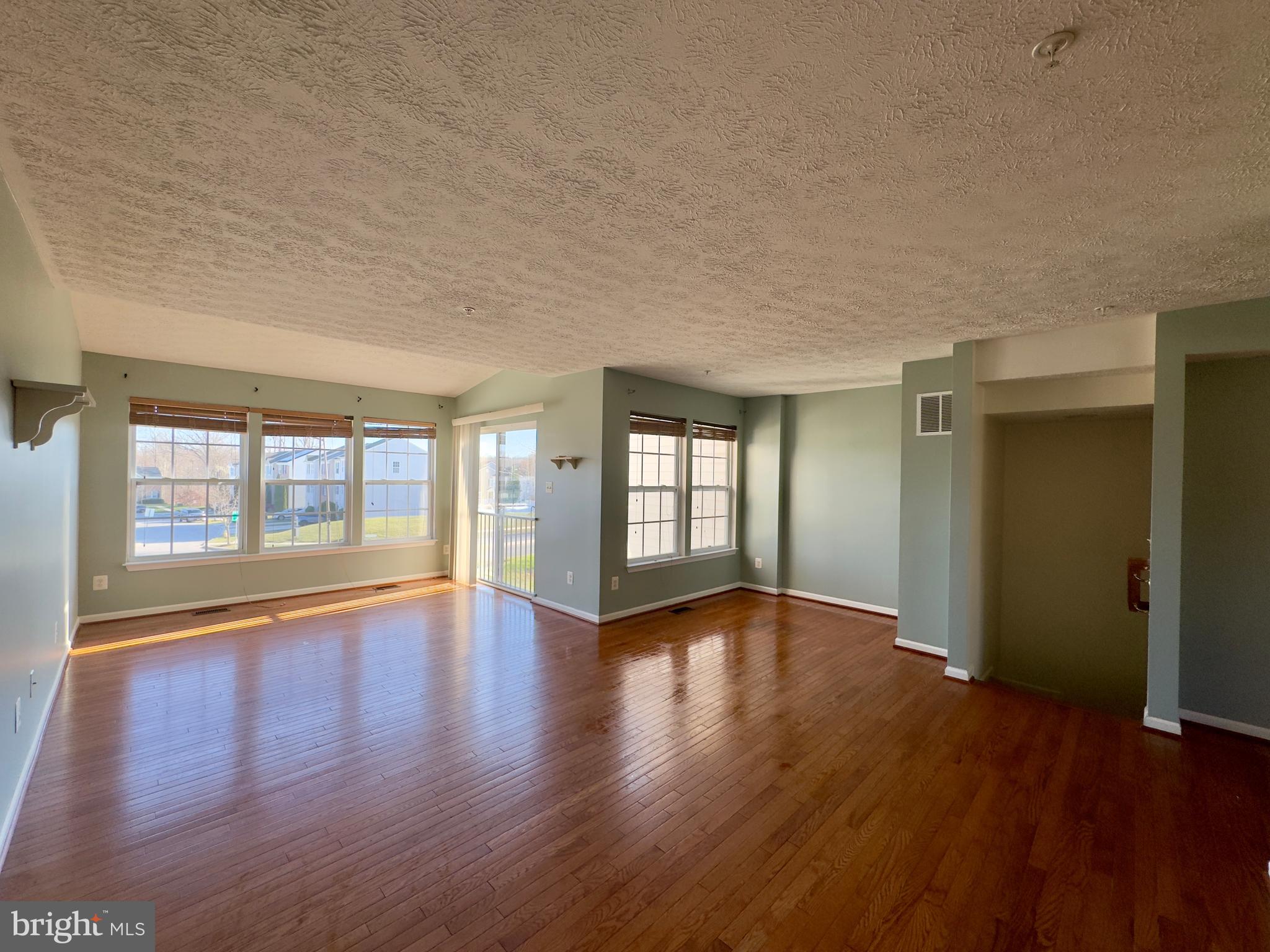 657 Possum Trot Way Aberdeen, MD 21001 - Photo 25 of 25 wooden floor in an empty room with a window
