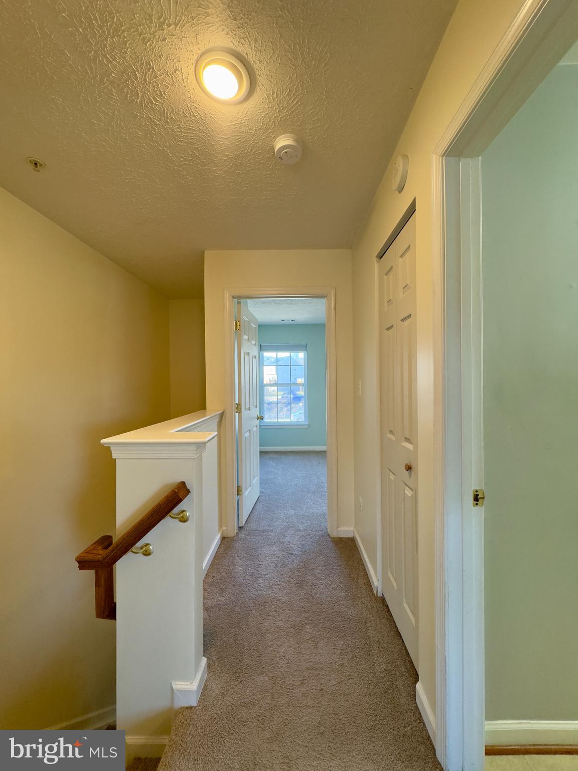 657 Possum Trot Way Aberdeen, MD 21001 - Photo 3 of 25 a view of a hallway with wooden floor and a bathroom