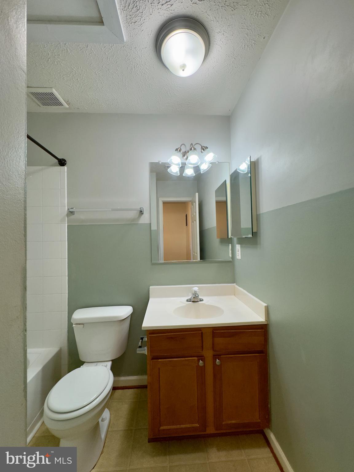 657 Possum Trot Way Aberdeen, MD 21001 - Photo 5 of 25 a bathroom with a toilet sink and mirror