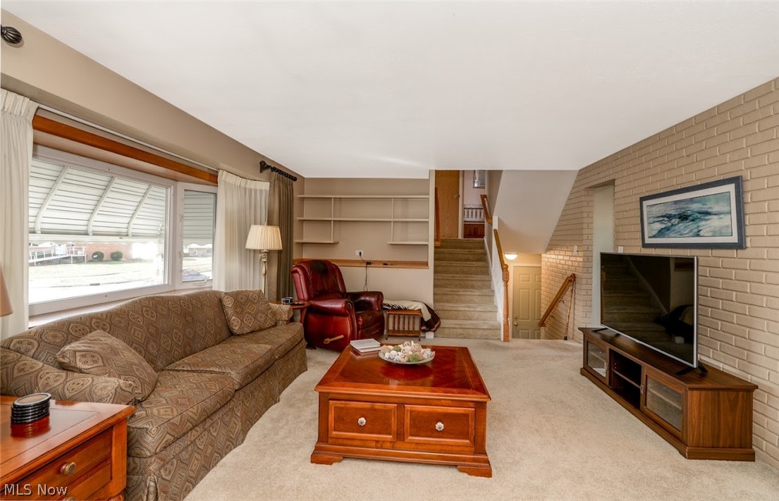 10930 Stoneham Road Cleveland, OH 44130 - Photo 2 of 22 Very nice Living Room with a bay window. Seller says there is hardwood under the carpet.
