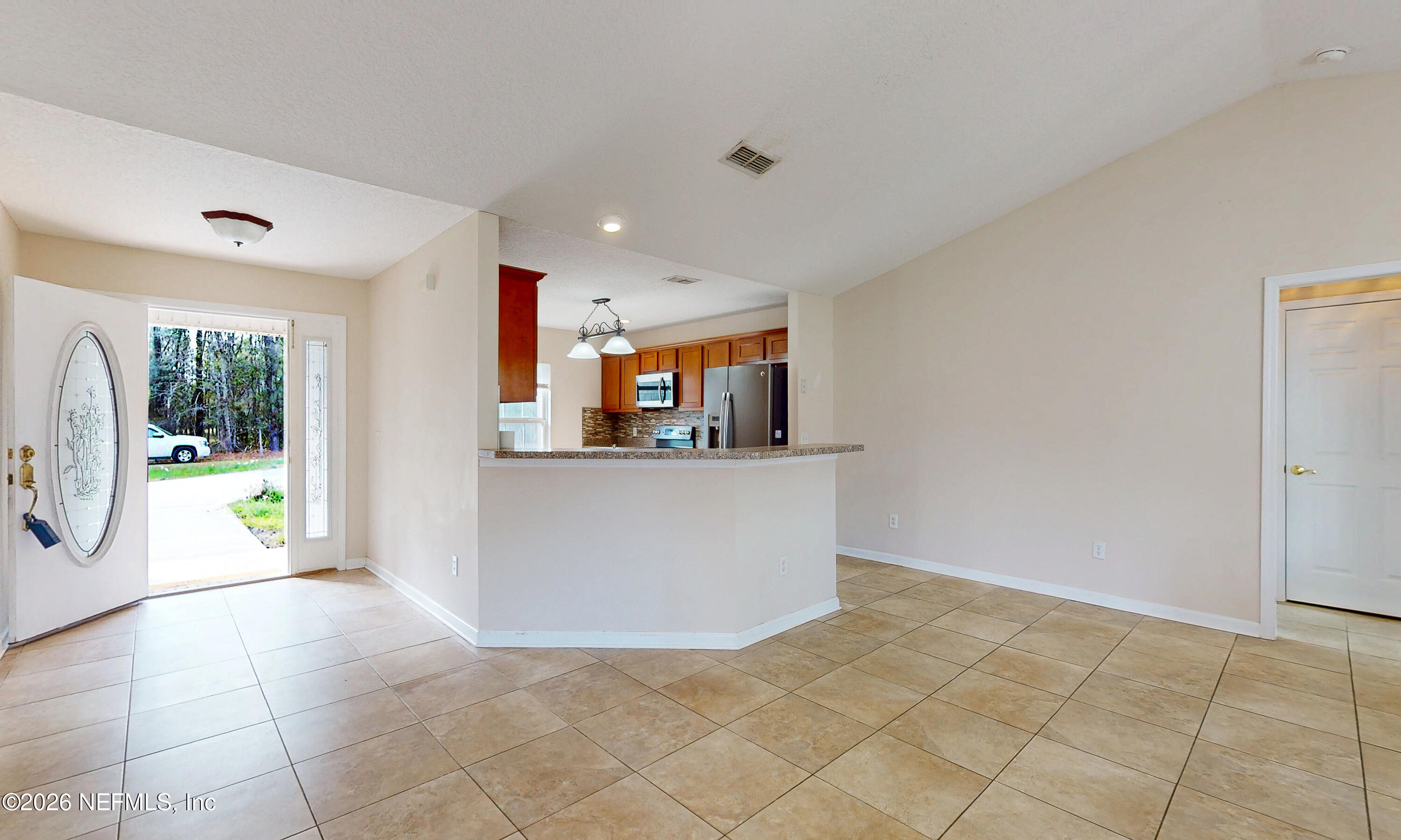 4333 Hawk Haven Road Middleburg, FL 32068 - Photo 13 of 51 a view of a kitchen with furniture and an entryway