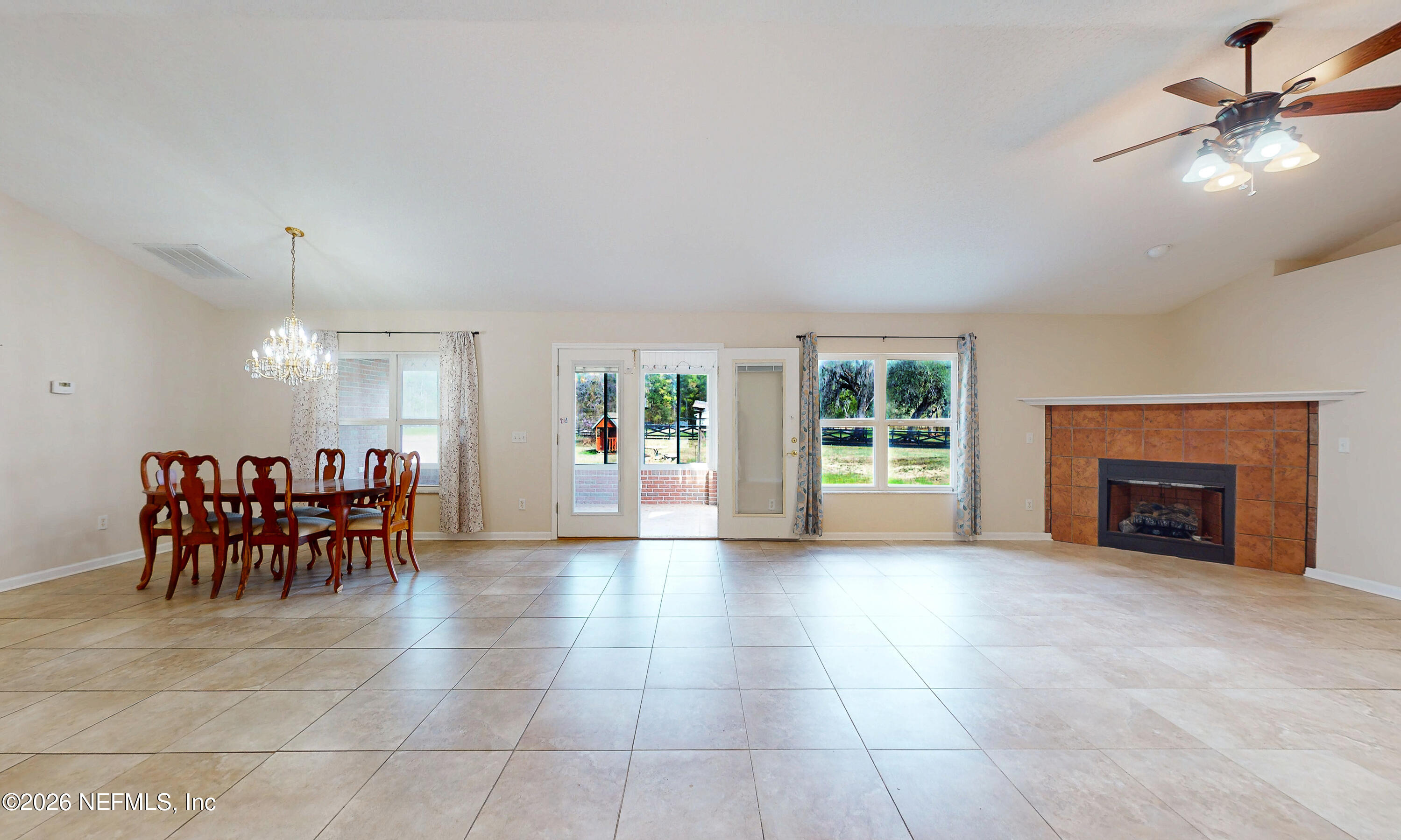 4333 Hawk Haven Road Middleburg, FL 32068 - Photo 16 of 51 a view of a dining room with furniture window and fireplace