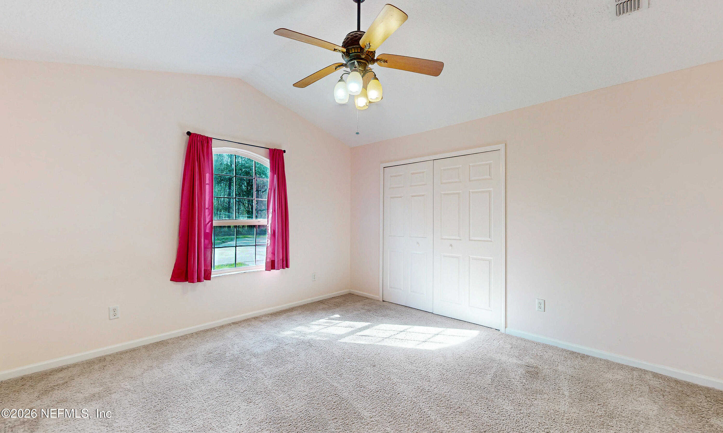 4333 Hawk Haven Road Middleburg, FL 32068 - Photo 24 of 53 an empty room with windows and fan