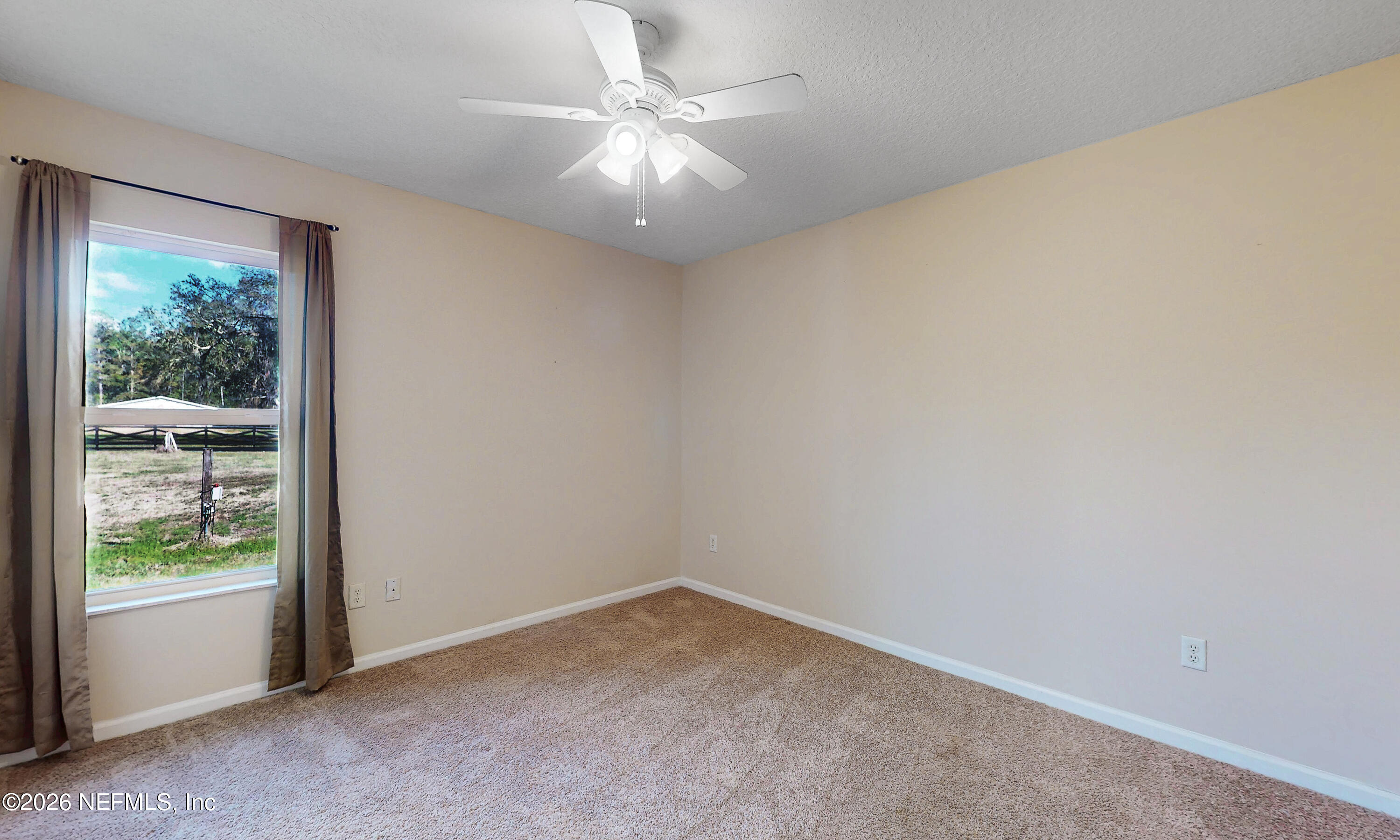 4333 Hawk Haven Road Middleburg, FL 32068 - Photo 29 of 51 an empty room with windows and ceiling fan