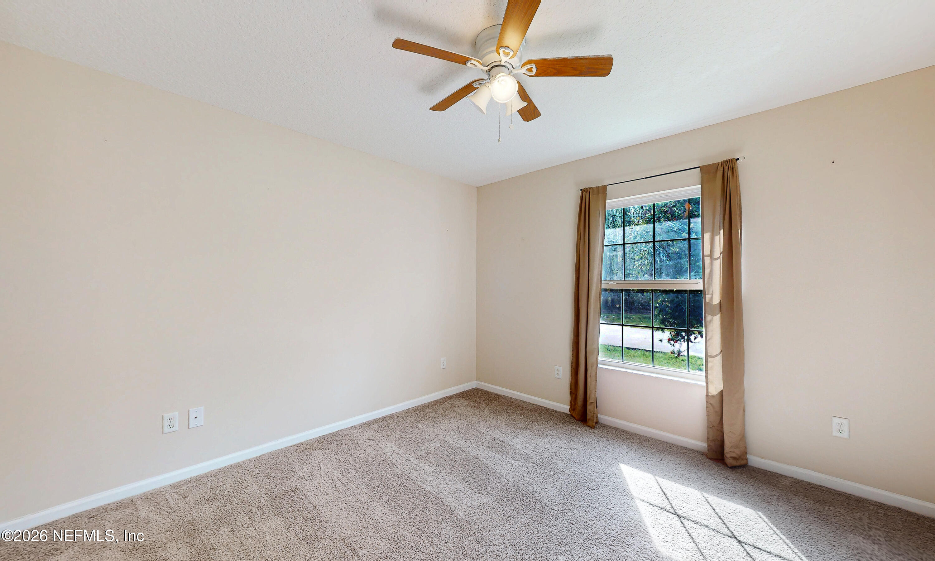 4333 Hawk Haven Road Middleburg, FL 32068 - Photo 31 of 51 an empty room with windows and fan