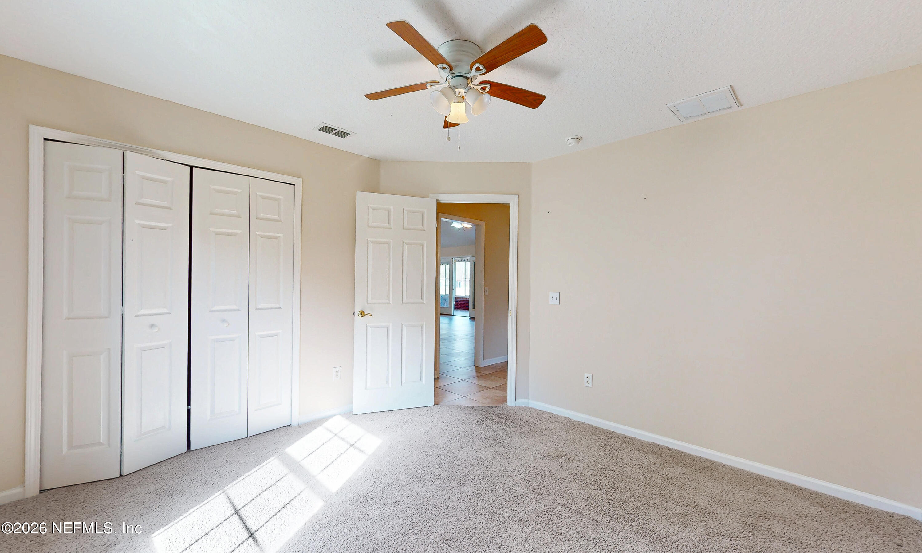 4333 Hawk Haven Road Middleburg, FL 32068 - Photo 32 of 51 an empty room with closet and a ceiling fan
