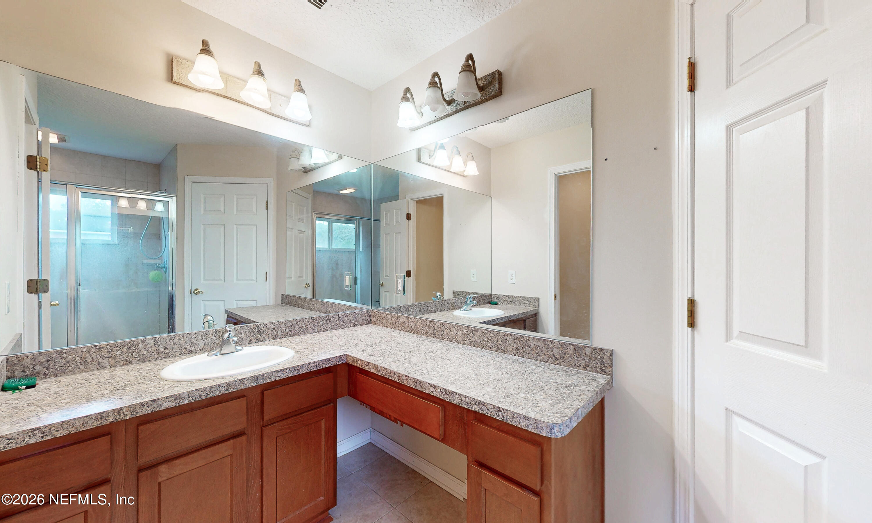 4333 Hawk Haven Road Middleburg, FL 32068 - Photo 36 of 51 a bathroom with a granite countertop sink and a mirror