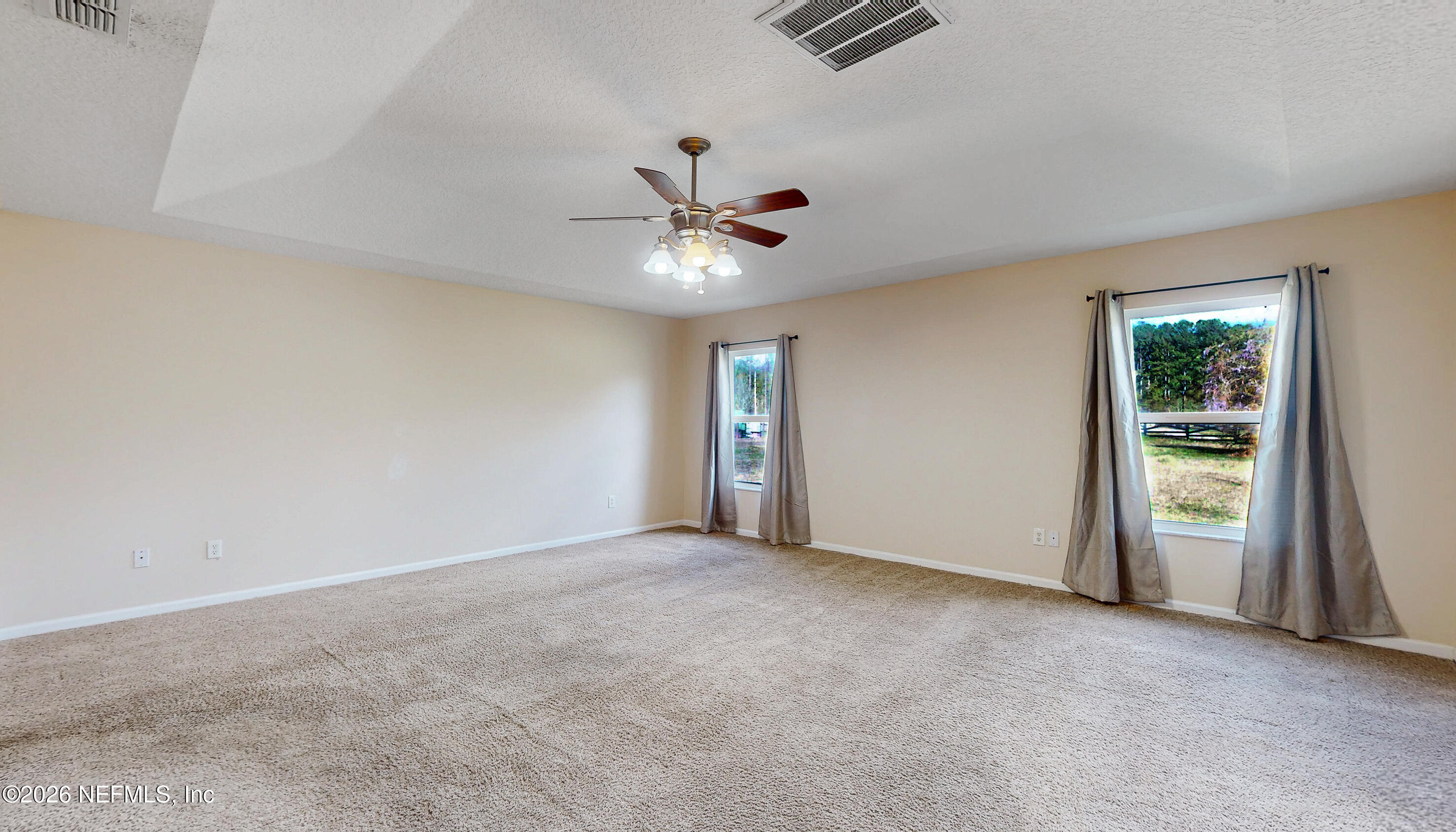 4333 Hawk Haven Road Middleburg, FL 32068 - Photo 38 of 51 an empty room with fan and windows