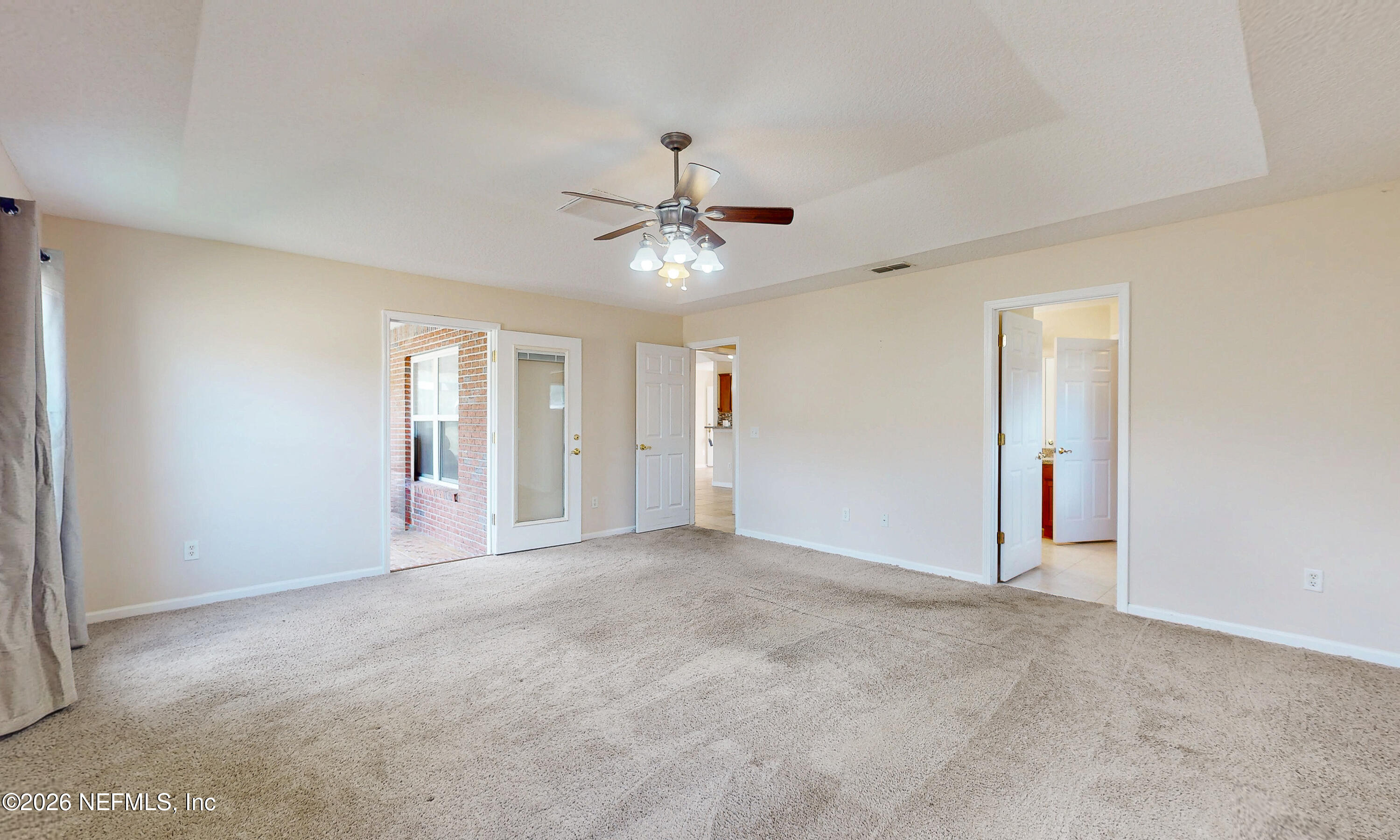 4333 Hawk Haven Road Middleburg, FL 32068 - Photo 39 of 51 a view of an empty room with chandelier fan and windows