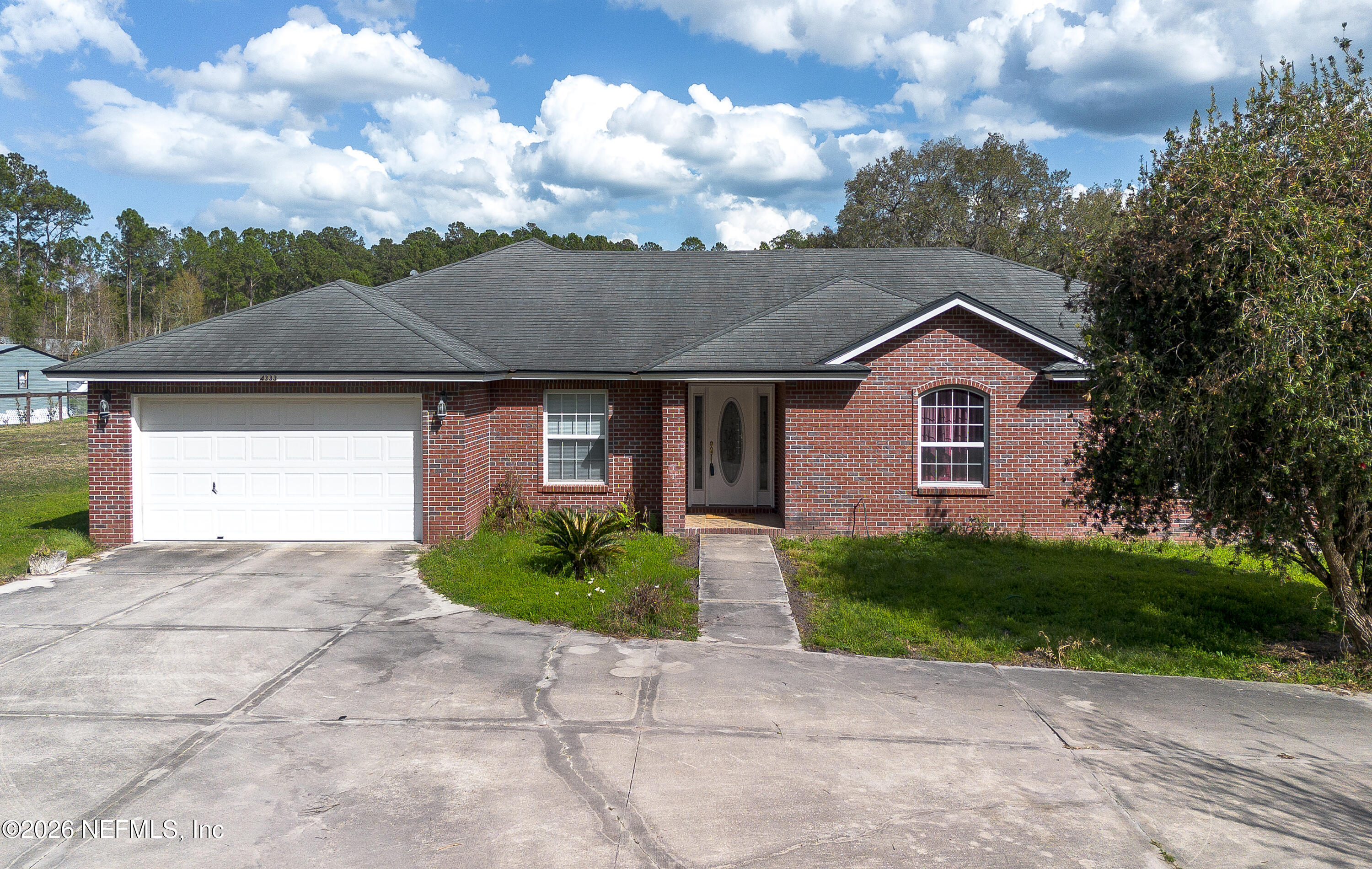 4333 Hawk Haven Road Middleburg, FL 32068 - Photo 45 of 51 a front view of a house with garden