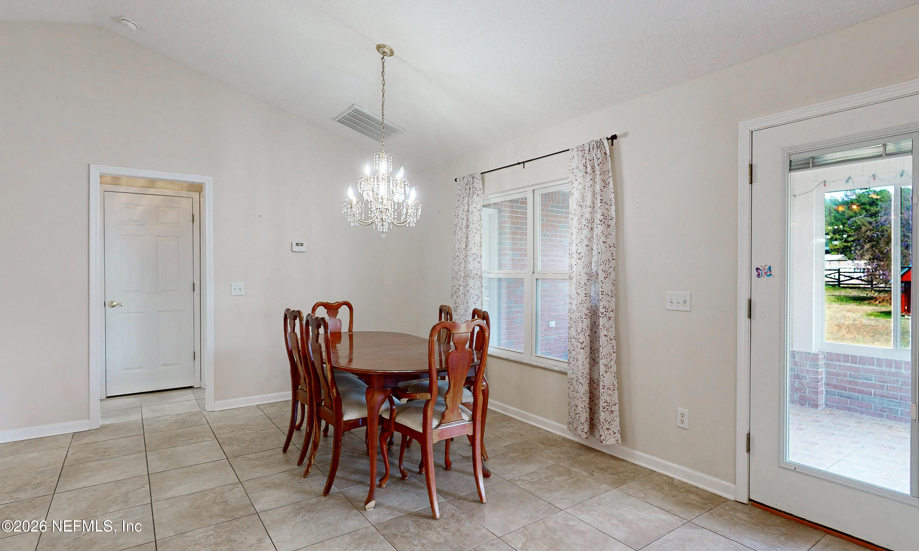 4333 Hawk Haven Road Middleburg, FL 32068 - Photo 9 of 51 a dining room with furniture and window