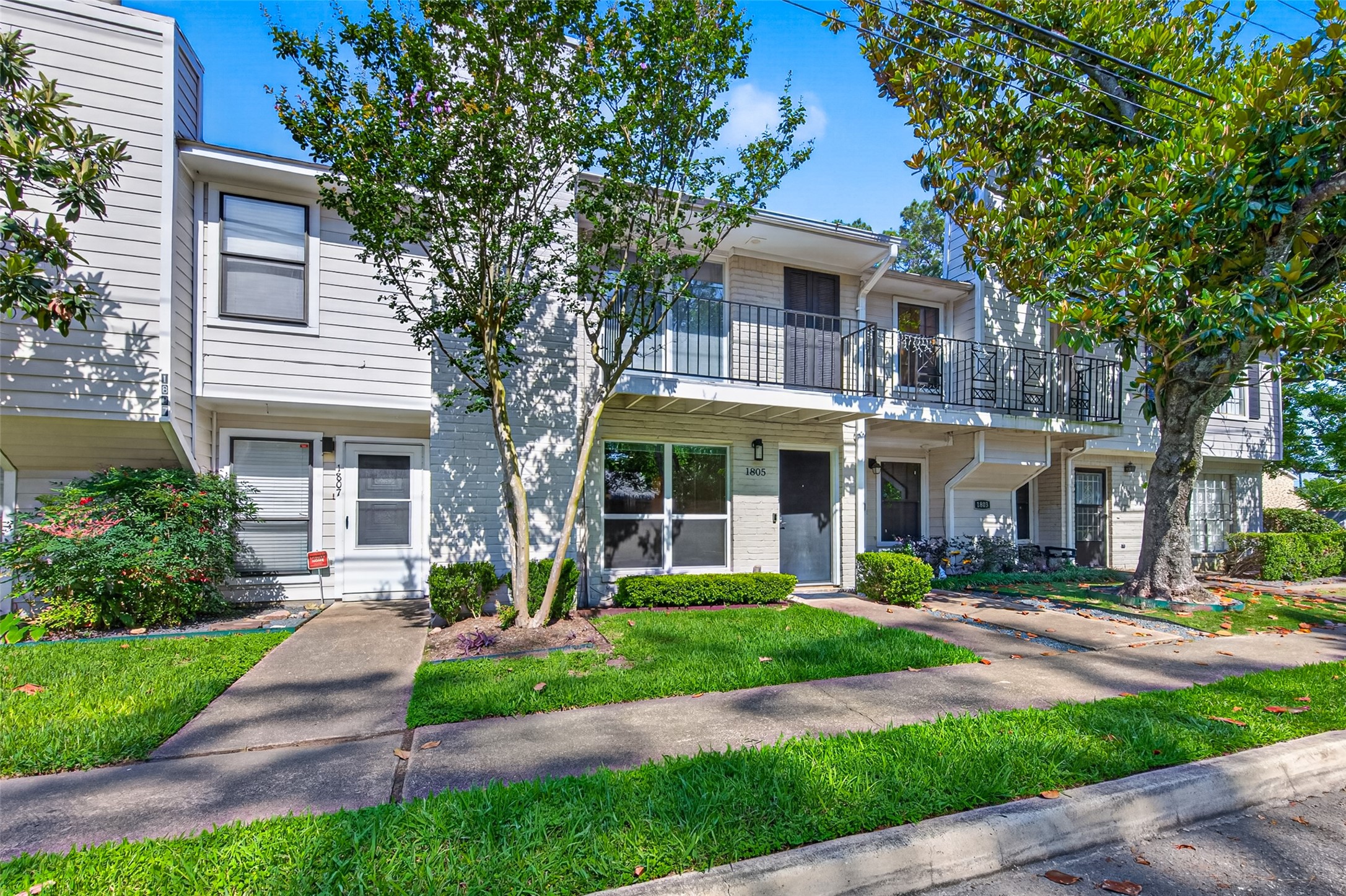 1805 Witte Road, Unit 3 Houston, TX 77080 - Photo 2 of 33 a front view of a house with garden and trees