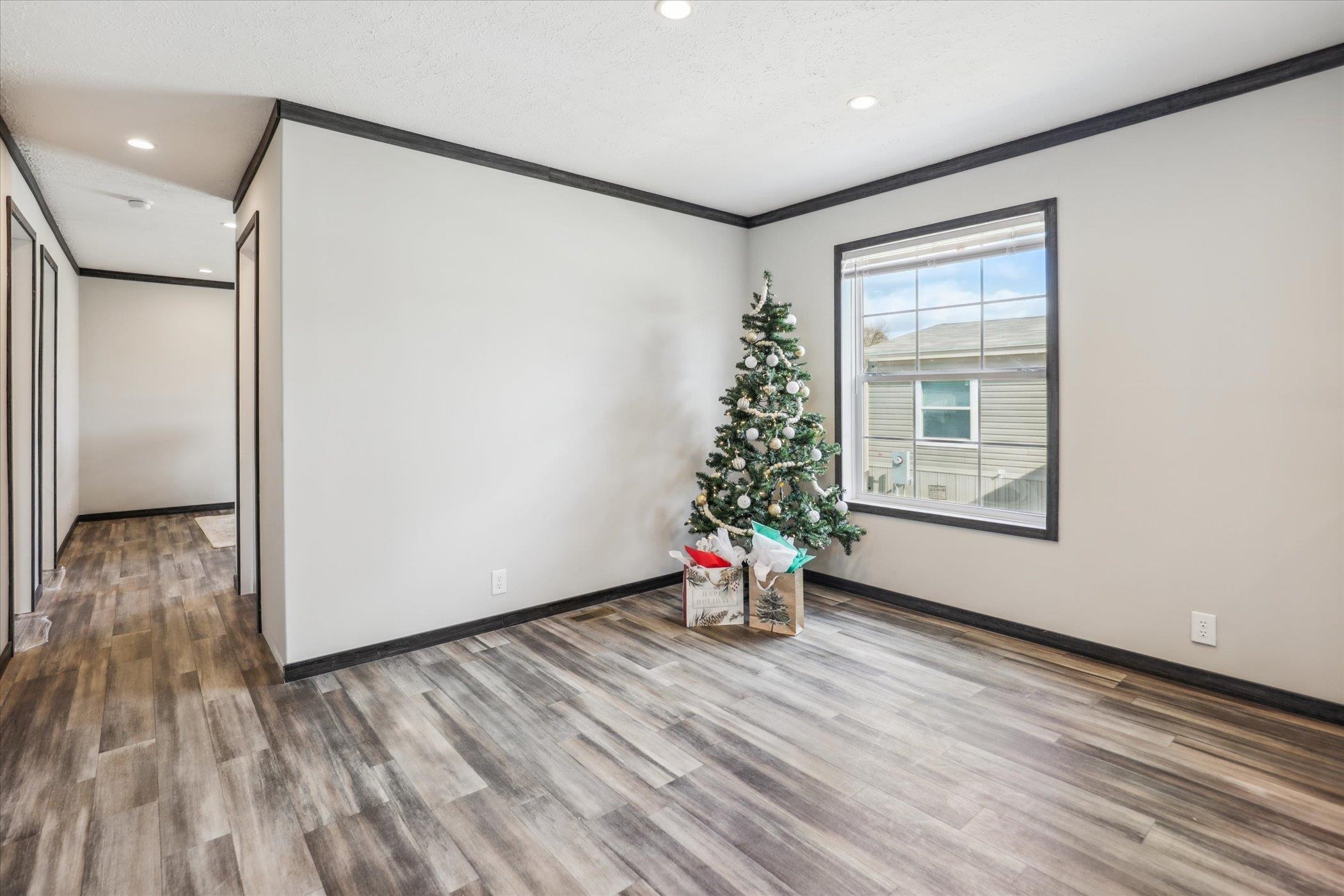 4046 Hinge Gate Lane Memphis, TN 38128 - Photo 11 of 24 a view of empty room with wooden floor and fan