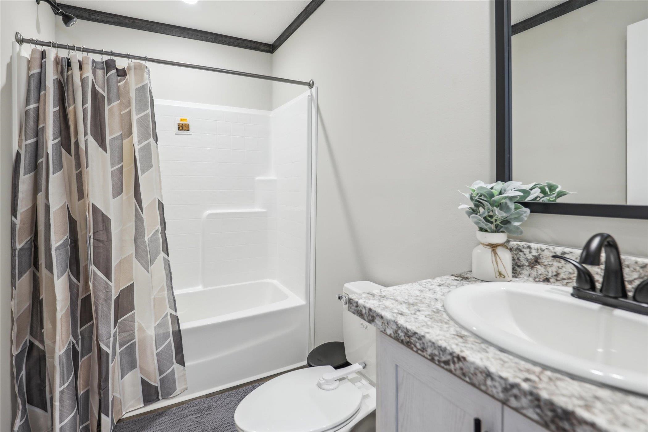 4046 Hinge Gate Lane Memphis, TN 38128 - Photo 18 of 24 a bathroom with a granite countertop sink toilet and shower