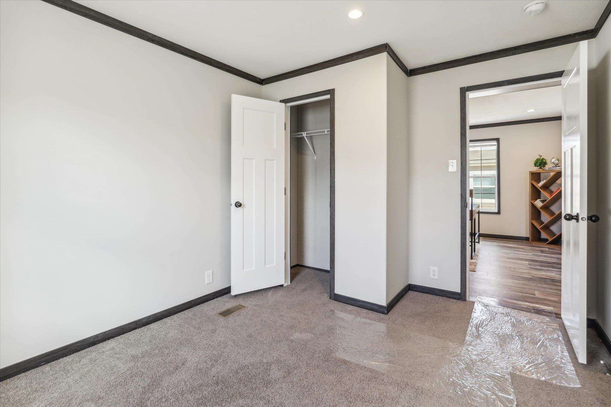 4046 Hinge Gate Lane Memphis, TN 38128 - Photo 22 of 24 a view of a hallway with wooden floor and closet