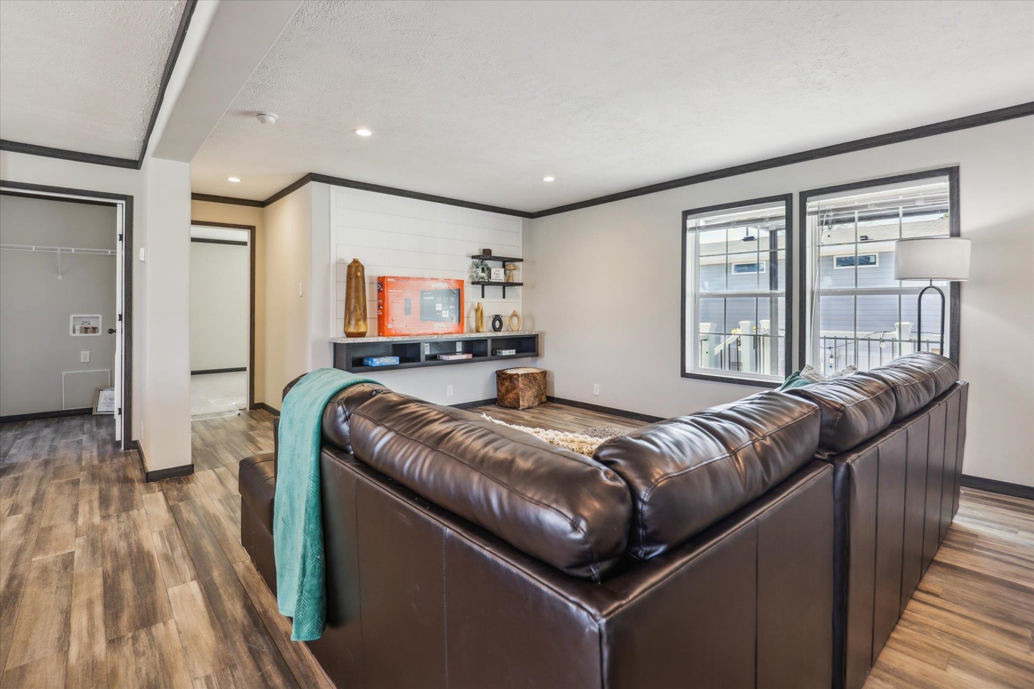 4046 Hinge Gate Lane Memphis, TN 38128 - Photo 4 of 24 a living room with a bed couch and a dresser next to a window