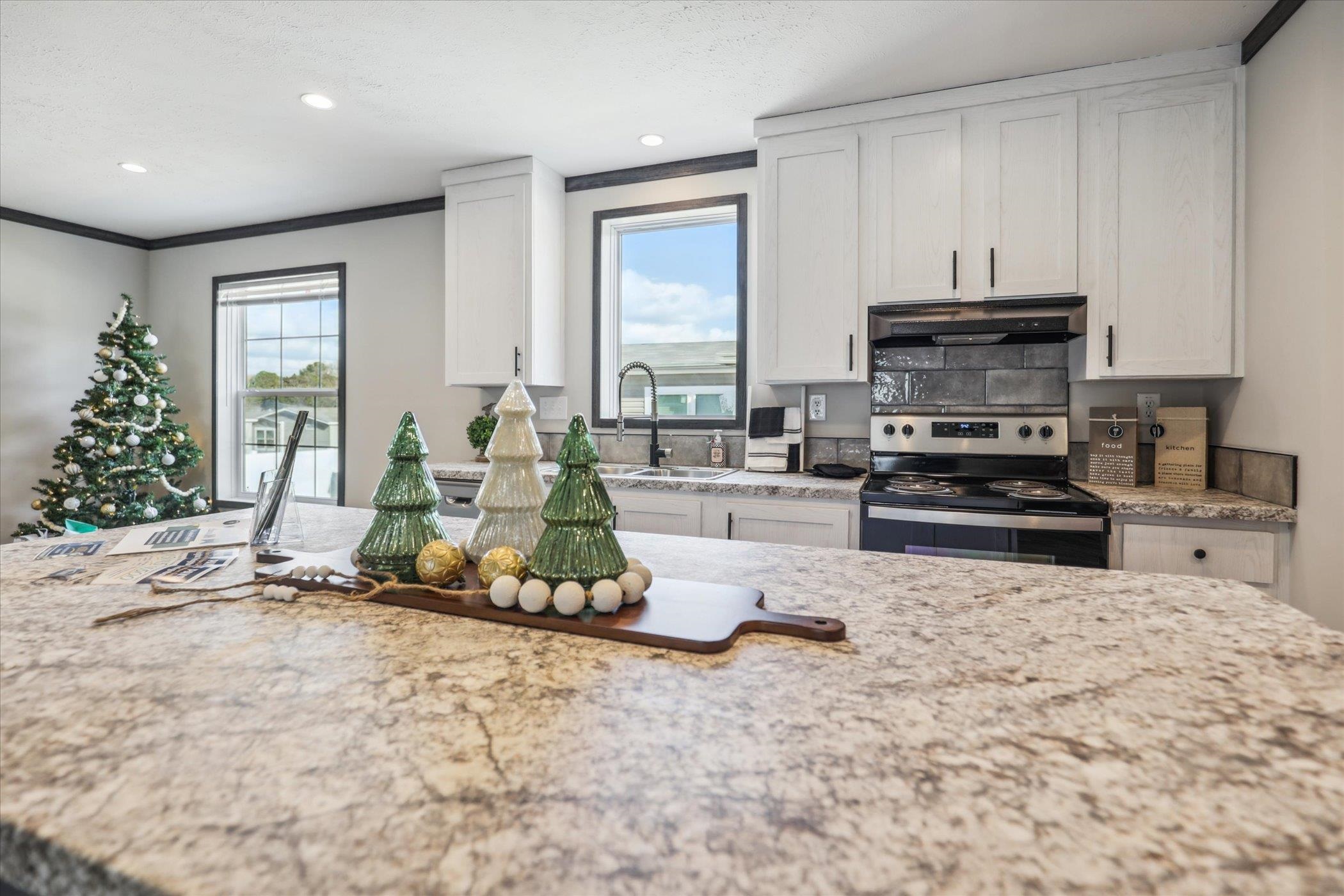 4046 Hinge Gate Lane Memphis, TN 38128 - Photo 8 of 24 a kitchen with stainless steel appliances granite countertop a stove a sink and a microwave
