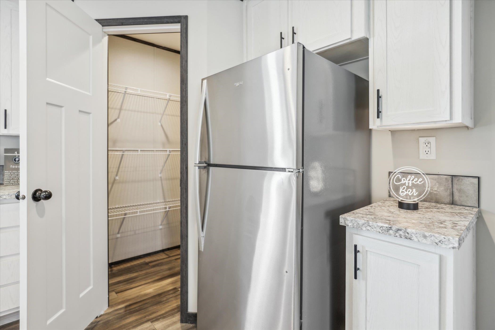 4046 Hinge Gate Lane Memphis, TN 38128 - Photo 10 of 24 a white refrigerator freezer and a stove sitting inside of a kitchen