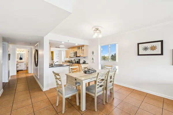 a kitchen with granite countertop a sink and a stove