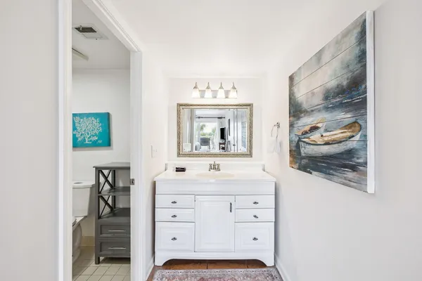 a view of a balcony with wooden floor
