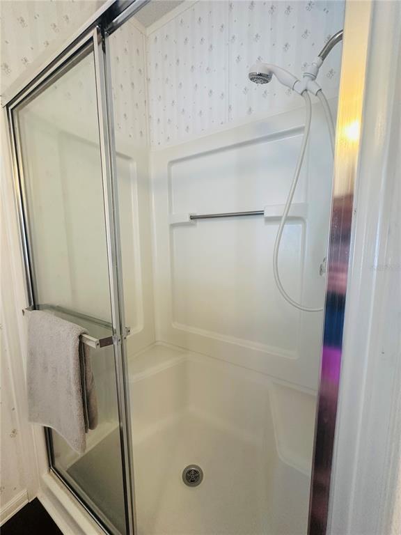 1100 South Belcher Road, Unit 406 Largo, FL 33771 - Photo 14 of 46 a bathroom with a glass shower door