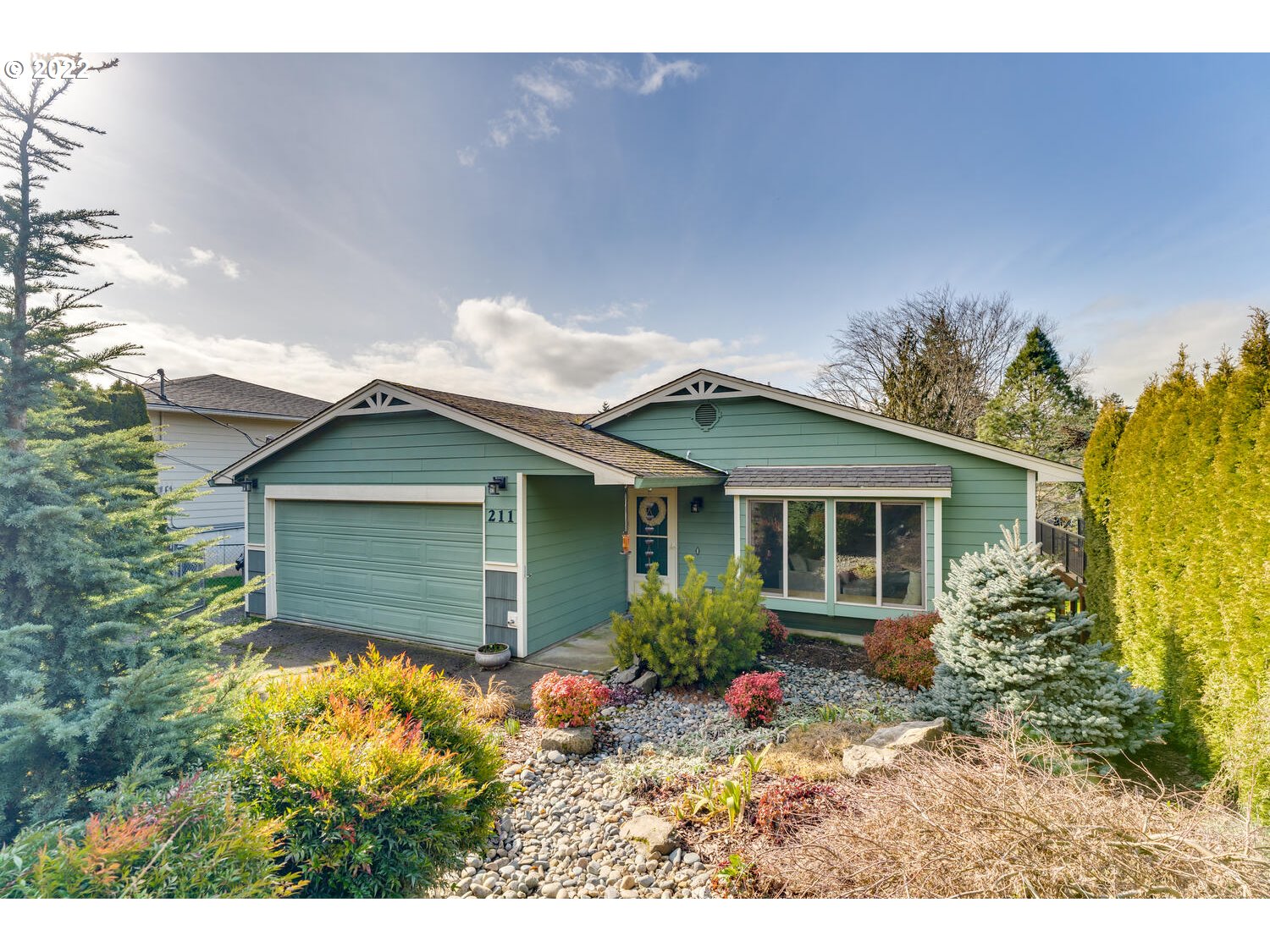 211 South 5th Avenue Ridgefield, WA 98642 - Photo 1 of 16 a view of house with garden