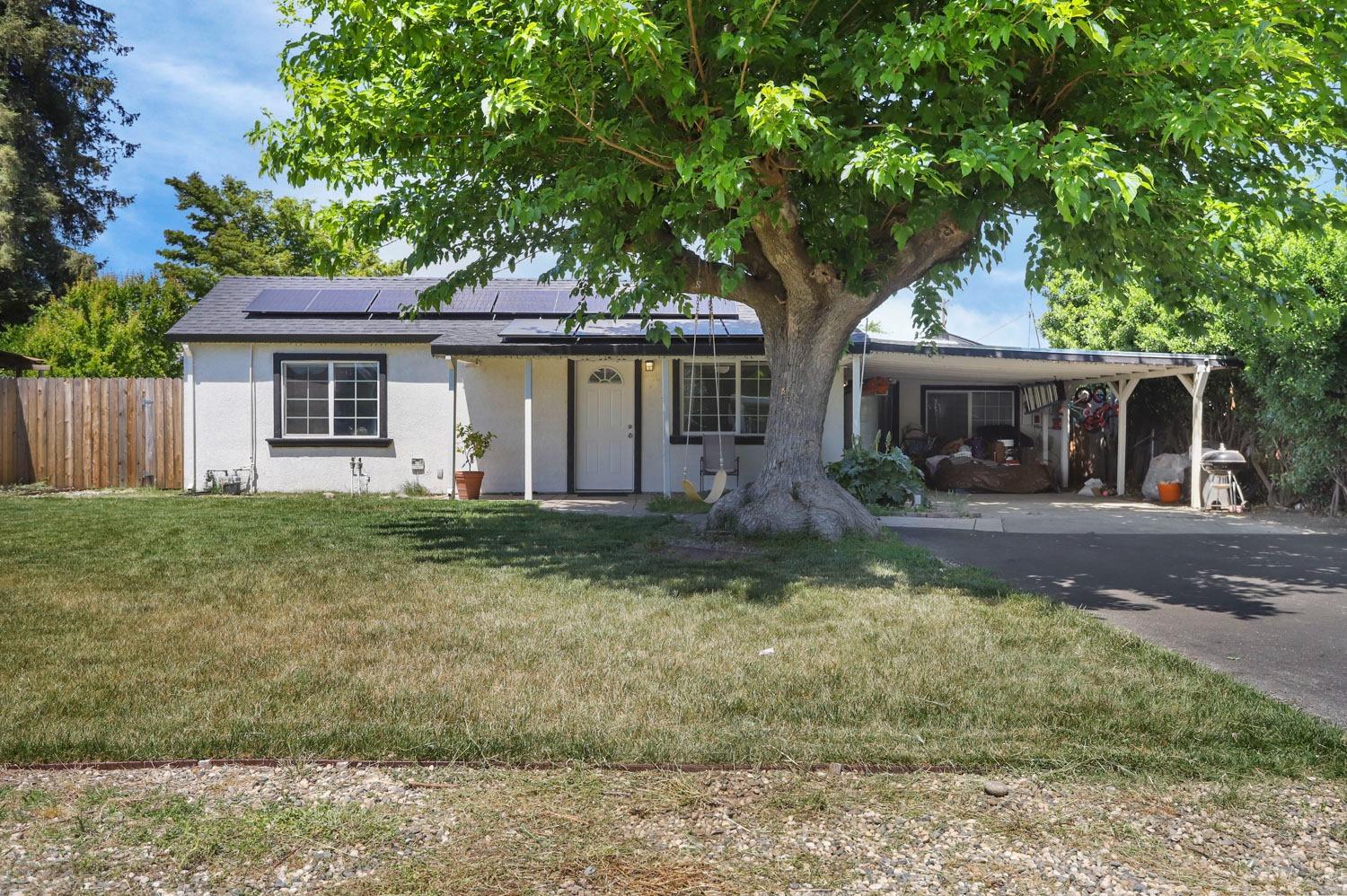 4601 East Cooper Road Acampo, CA 95220 - Photo 1 of 1 front view of a house with a yard